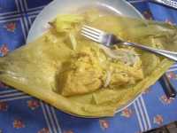 Una "humita", un plato t�pico chileno que es ma�z (choclo) molido cocido envuelto con cebollas y especies, envuelto en las hojas del choclo y cocido al vapor

An "humita", a typical Chilean dish consisting of mashed corn mixed with onions, and spices,  wrapped in corn husks and steamed