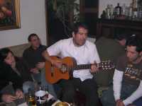 C. en su cumplea�os tocando guitarraC. at his birthday playing guitar