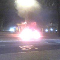 A car burning in the street